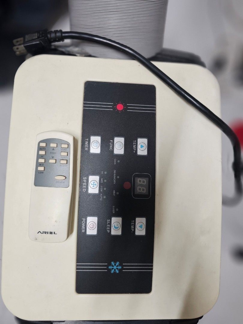 ARIEL AMB-14 Portable Air Conditioner (Category: Hair) located in Manila. Submitted by mhineth (Listing ID 1462506913, Image 3). Description: - ARIEL Portable Air Conditioner (Model AMB-14) - Cooling Capacity: 1700W - Heating Capacity: 1500W - Moisture Removal: 70 Liters/Day - Refrigerant Type: R410A - Comes with Remote Control - In excellent working condition.