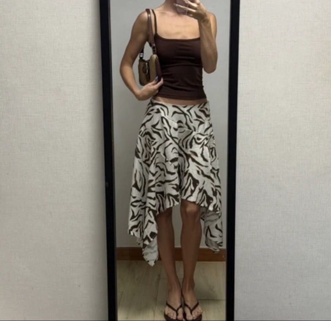 Asymmetrical Midi Skirt (Category: Skirts) located in Pasig City. Submitted by nosaintdom (Listing ID 1462620999, Image 2). Description: Asymmetrical Printed Skirt - Knee length - Not stretchable/ With zipper on the side - Size Small (26in Waist) - Used once only - Bought in Shein for 380 pesos.
