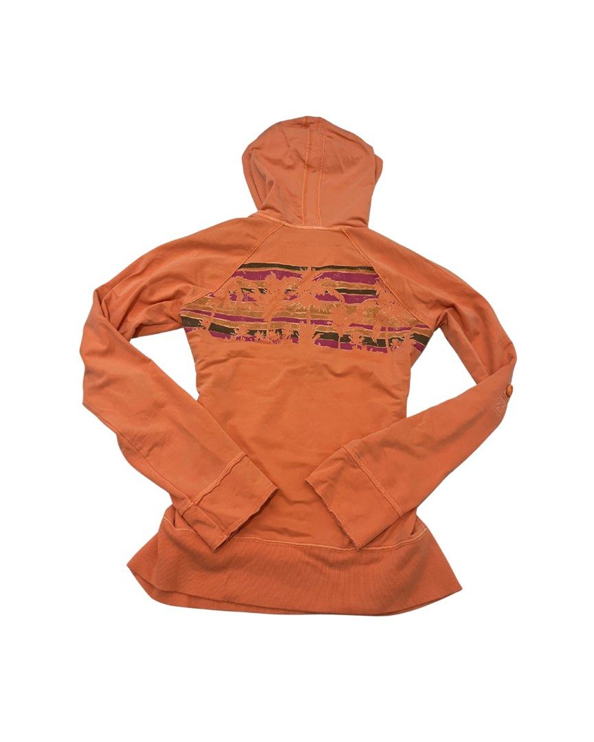 Aunthentic Y2k Gap Hoodie (Category: Hoodies) located in Marikina City. Submitted by dowsie.shop4divas (Listing ID 1462556575, Image 3). Description: - Orange hoodie from The Gap - Size Medium (M) - '1969' graphic print on the front - Quarter zip closure - Front kangaroo pocket - Button tabs on sleeves for adjustable length - Palm tree graphic print on the back.