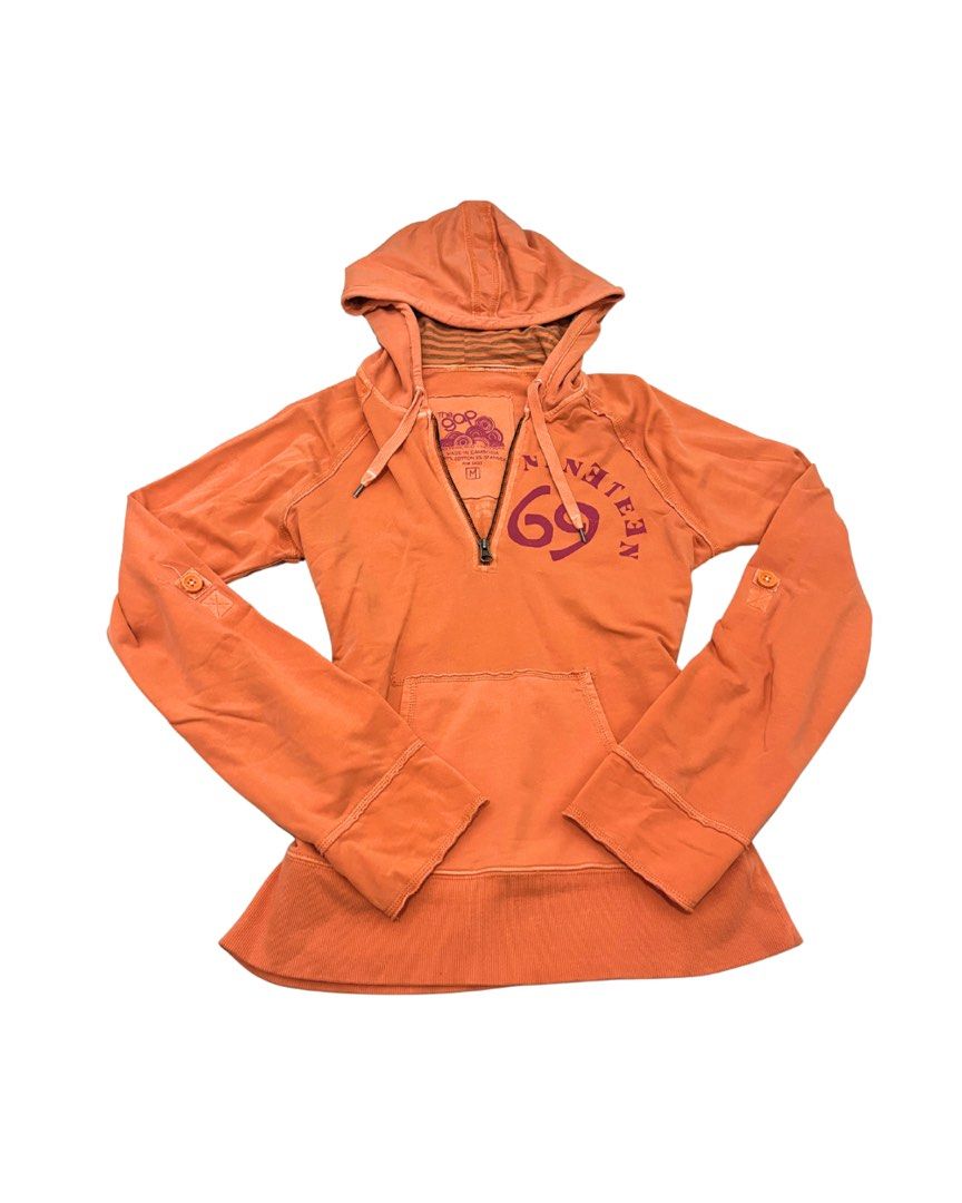 Aunthentic Y2k Gap Hoodie (Category: Hoodies) located in Marikina City. Submitted by dowsie.shop4divas (Listing ID 1462556575, Image 1). Description: - Orange hoodie from The Gap - Size Medium (M) - '1969' graphic print on the front - Quarter zip closure - Front kangaroo pocket - Button tabs on sleeves for adjustable length - Palm tree graphic print on the back.