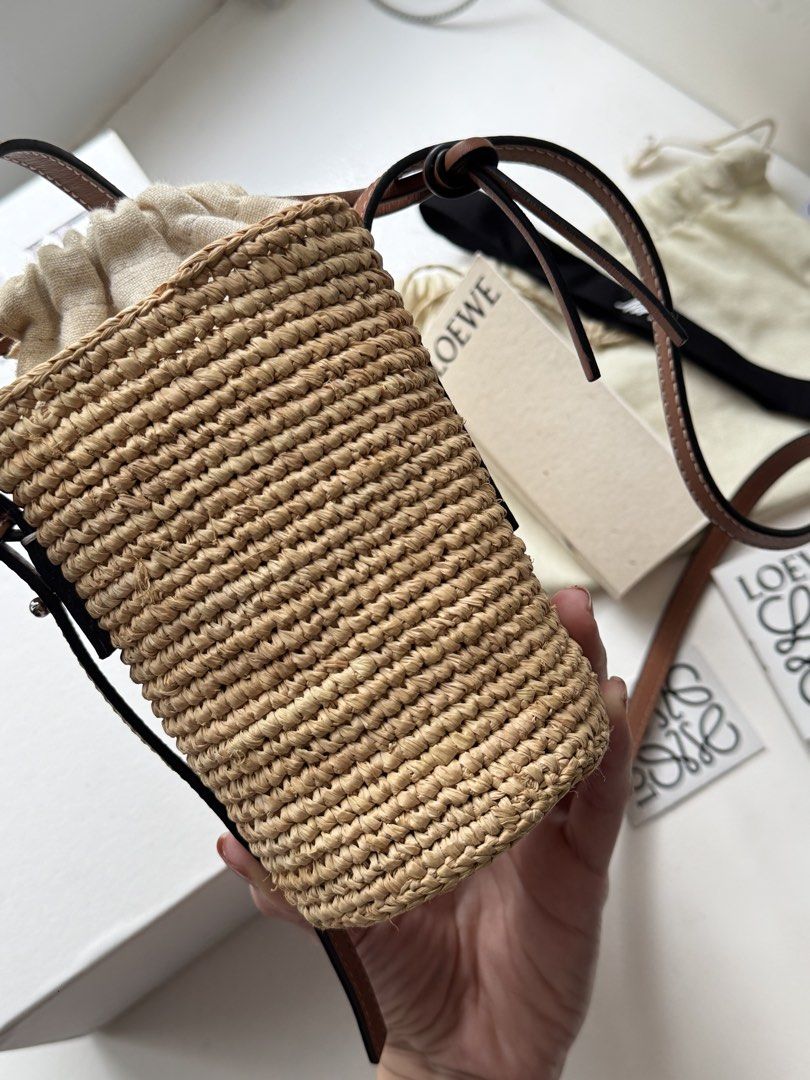 Auth Loewe Raffia Basket Bag (Category: Luxury Bags & Wallets) located in Pasay City. Submitted by shop.stylestaple (Listing ID 1462509082, Image 3). Description: - Authentic Loewe basket bag - Made from raffia and calfskin - Comes with original dust bag and tags - Purchased from Mr Porter - Ideal for summer outings Selling super low at 36,000php.