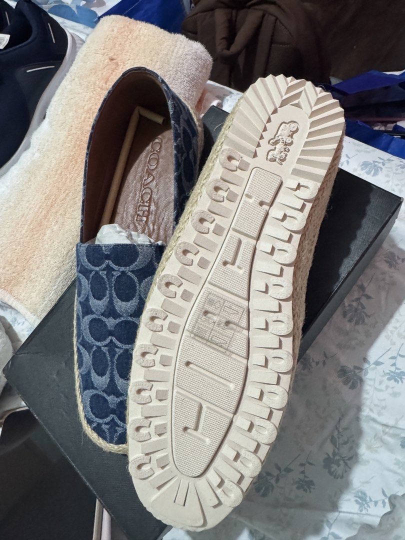 AUTHENTIC Coach Denim Signature Espadrille Flats (Category: Flats & Sandals) located in Cainta. Submitted by trufflecake (Listing ID 1462531842, Image 3). Description: - Coach espadrille flats in signature denim print - Comfortable slip-on style - Jute rope trim around the sole - Coach logo embossed on insole and outsole - Ideal for casual wear.