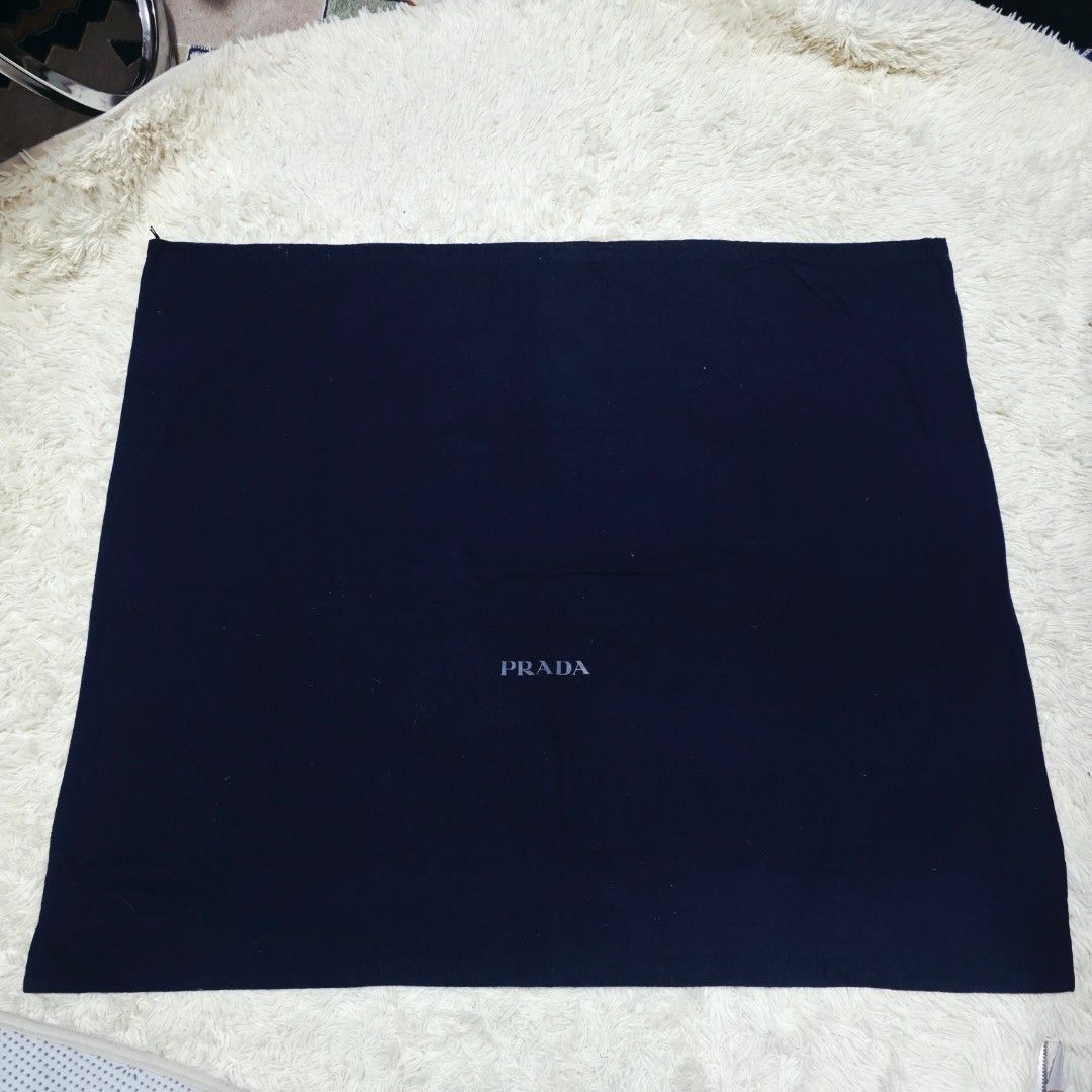 Authentic Prada dust bag 26x31 inches (Category: Tote Bags) located in Manila. Submitted by jfluxury.co (Listing ID 1462650047, Image 2). Description: excellent condition like new no flaws bought in Japan 🇯🇵 💯% Authentic. 😊 Money back guarantee. 😊 Clean and ready to use na.