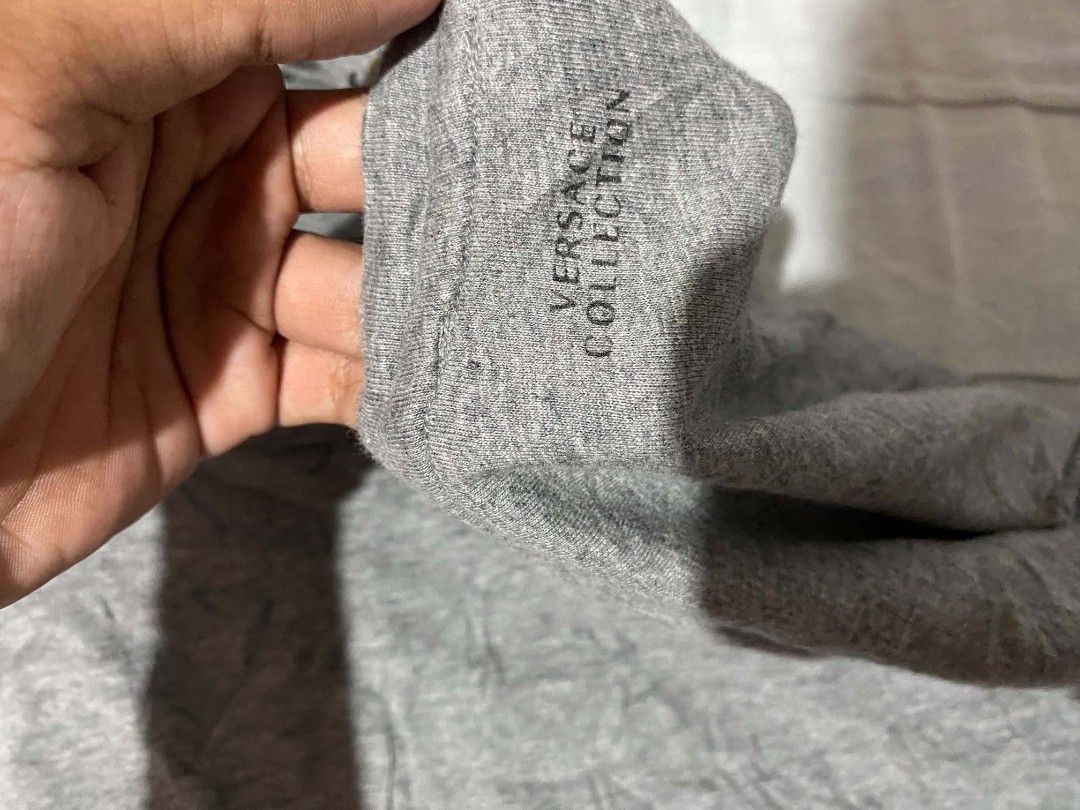 Authentic Versace Collection Womens Grey T-Shirt (Category: Tshirts & Polo Shirts ) located in Santa Cruz. Submitted by pagkaliwag03487 (Listing ID 1462456115, Image 3). Description: - Versace Collection Grey T-Shirt - Striking gold and black print on chest and shoulders - Made in Turkey - Comfortable cotton blend fabric - Authentic, check tag for verification - Perfect statement piece for your wardrobe.