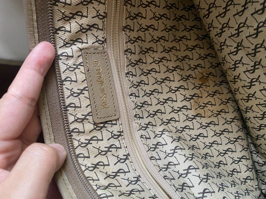 Authentic Yves Saint Laurent YSL Monogram Pouch Clutch (Category: Luxury Bags & Wallets) located in Batangas. Submitted by lux_kimmy (Listing ID 1462521417, Image 3). Description: - Authentic YSL pouch - Classic beige and brown monogram pattern - Interior zippered pocket and main compartment - Ideal for organizing essentials or as a clutch this is authentic, bought from Japan live sellers of luxury bags before. selling super low price RFS: declut
