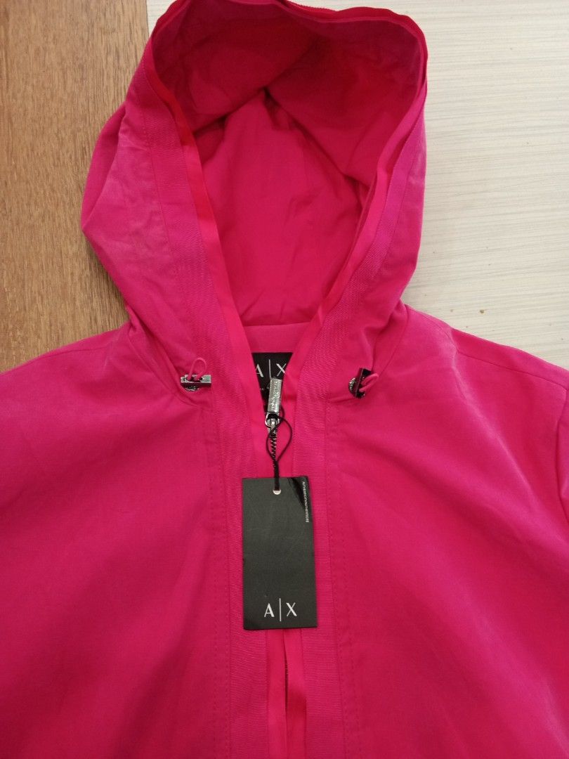 AX Armani Exchange Pink Hooded Jacket S (Category: Coats, Jackets and Outerwear) located in Bogo. Submitted by thrift_kier (Listing ID 1462586901, Image 2). Description: - Pink AX Armani Exchange jacket - Hooded design with drawstring waist - Full zip front closure - Size: S - Made in China - Original tag attached, showing original price of $300.00.