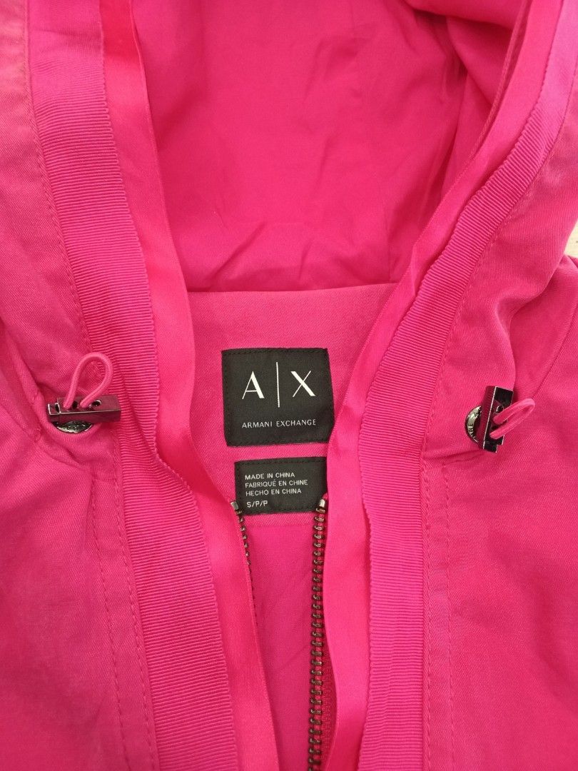 AX Armani Exchange Pink Hooded Jacket S (Category: Coats, Jackets and Outerwear) located in Bogo. Submitted by thrift_kier (Listing ID 1462586901, Image 3). Description: - Pink AX Armani Exchange jacket - Hooded design with drawstring waist - Full zip front closure - Size: S - Made in China - Original tag attached, showing original price of $300.00.