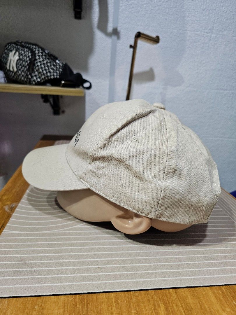 Balenciaga cotton baseball cap (Category: Caps & Hats) located in Baguio. Submitted by kayeonlineshop (Listing ID 1462550911, Image 3). Description: -beige Balenciaga cotton baseball cap featuring bold black embroidered lettering across the front panel.