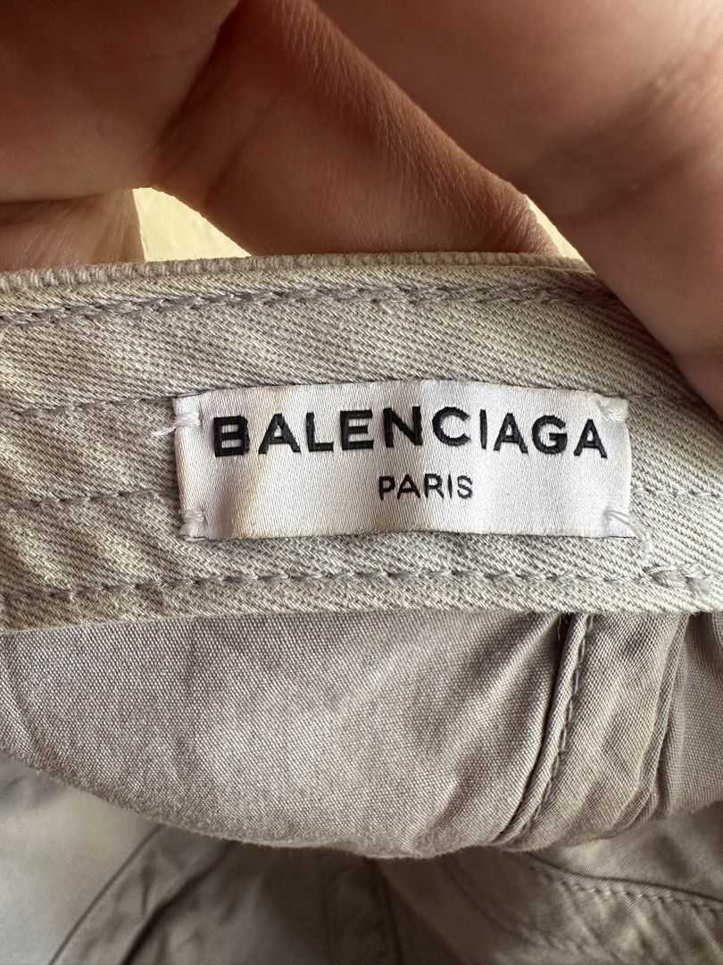 Balenciaga Embroidered Logo Hat (Category: Caps & Hats) located in Digos. Submitted by jayarshop (Listing ID 1462515942, Image 2). Description: - Condition: Pre-owned/Good condition with normal signs of wear (slight fading/discoloration on the inner brim and back strap as pictured). - Color: Light Gray / Off-White - Size: L (58 cm) - Details: Features the iconic embroidered Balenciaga logo on the front. Classic 6-panel design with an adjustable h
