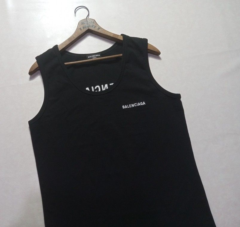Balenciaga Embroidered Tank Top (Category: Luxury Apparel) located in Urdaneta. Submitted by josephragontonjr95 (Listing ID 1462511863, Image 3). Description: - Balenciaga Embroidered Tank Top - SIZE: Medium - DIMENSIONS ⬇️⬇️⬇️ - WIDTH: 19-24 - LENGTH: 27 - COLOR RATE: 9.8/10 - ISSUES/FLAWS: NONE - CONDITION: AS NEW - 2,150 + SHIPPING FEE.