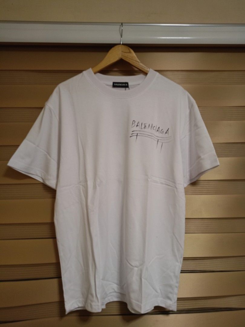 Balenciaga "This is Not" Shirt (Category: Luxury Apparel) located in Valenzuela. Submitted by One.Only.Nan (Listing ID 1462626517, Image 3). Description: XL on tag Actual W23" L30" Excellent condition 10 color rate MOP GCASH MAYA AUB BPI VALENZUELA CITY LOC.