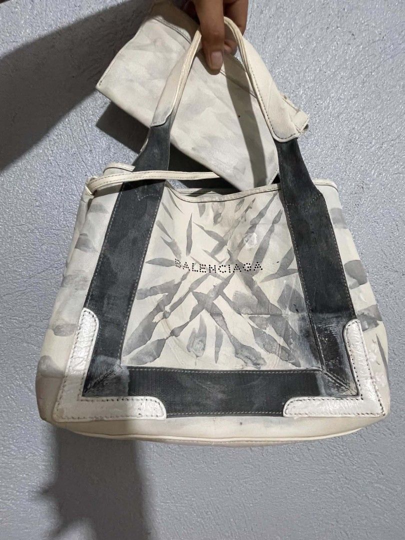 Balenciaga Tote Bag with Pouch (Category: Luxury Bags & Wallets) located in Manila. Submitted by buyingprelovedukayukay (Listing ID 1462616983, Image 1). Description: - Balenciaga tote bag with unique abstract print - Includes a matching pouch - Canvas has some marks and discoloration - A statement piece with character, perfect for everyday use.