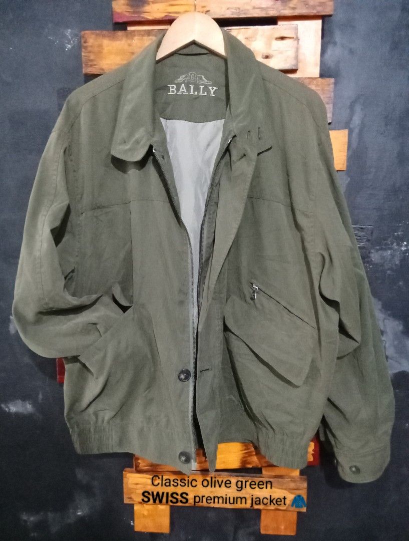 Bally Classic Olive Green Premium Swiss Jacket (Category: Coats, Jackets and Outerwear) located in Caloocan City. Submitted by calmcat_6fd4f7 (Listing ID 1462662290, Image 1). Description: - Classic olive green Bally jacket - Made in Switzerland - Zip-up front with button closure - Two front pockets - One zippered chest pocket - Elasticated cuffs and hem - Ideal for everyday wear.