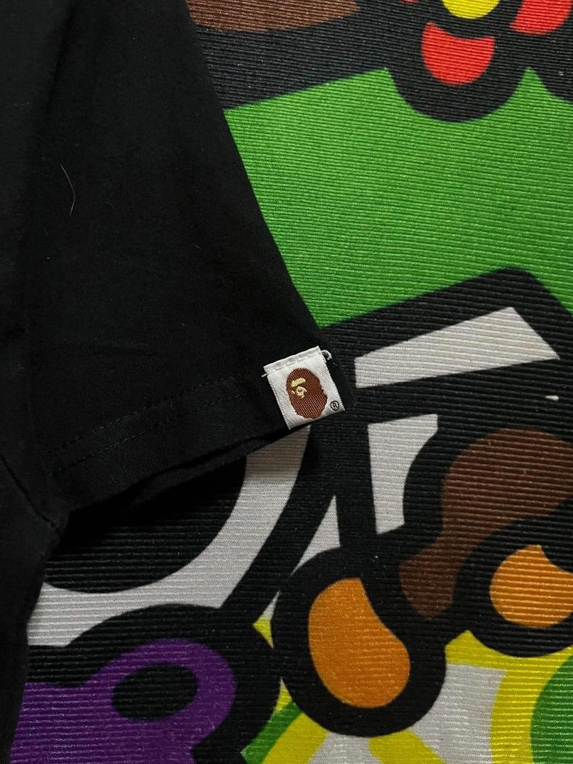 BAPE (Category: Tshirts & Polo Shirts ) located in Taguig. Submitted by bimbyanche19839 (Listing ID 1462603446, Image 3). Description: A Bathing Ape Size: Med-Large Width: 20 Length: 28 Color Rate: 9.5/10 Good Condition No flaws 🏷️250php plus ship 📍Taguig Location.