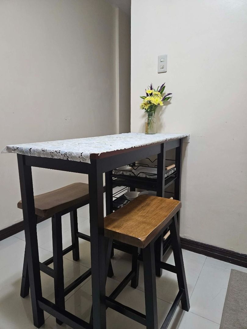 Bar Table Dining Set with Open Shelves for Storage (Category: Tables & Sets) located in Cainta. Submitted by cannappy (Listing ID 1462650559, Image 1). Description: Compact dining set perfect for small spaces. It's made of solid Malaysian rubber wood and has 3 layers of open shelves that can be used for storage. This comes with 3 removable metal storage racks (bought separately from the orange app) that fits perfectly into the shelves. Dimensions