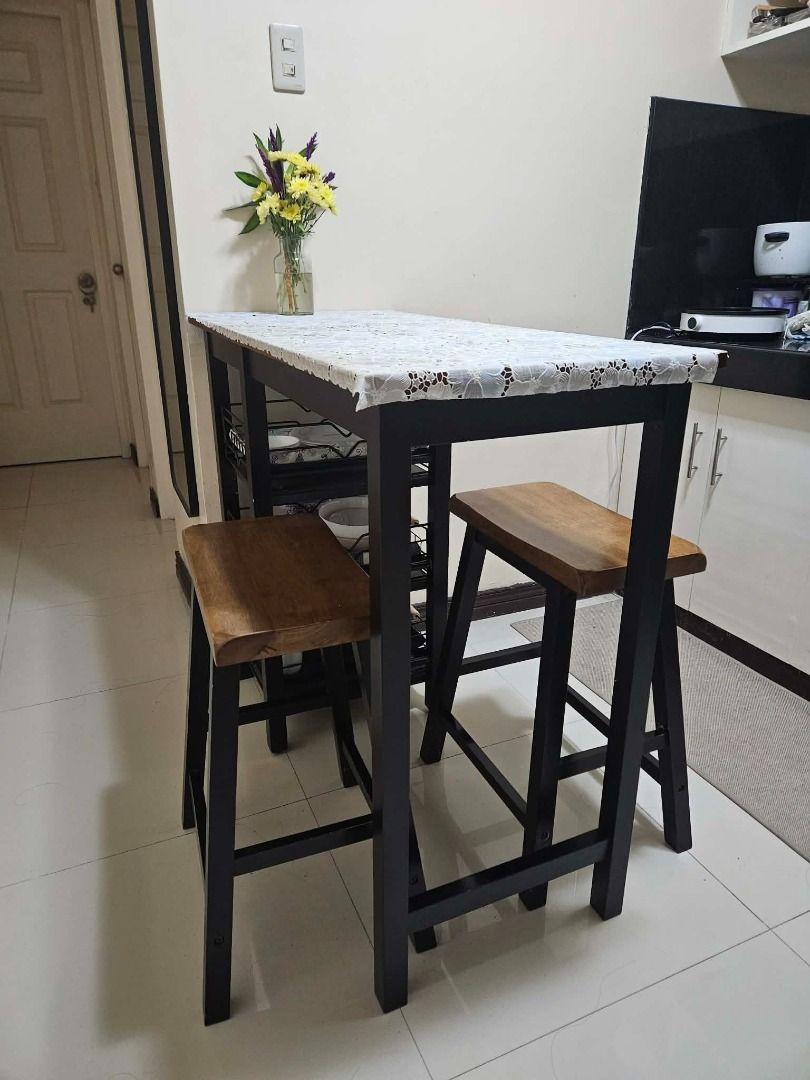 Bar Table Dining Set with Open Shelves for Storage (Category: Tables & Sets) located in Cainta. Submitted by cannappy (Listing ID 1462650559, Image 3). Description: Compact dining set perfect for small spaces. It's made of solid Malaysian rubber wood and has 3 layers of open shelves that can be used for storage. This comes with 3 removable metal storage racks (bought separately from the orange app) that fits perfectly into the shelves. Dimensions