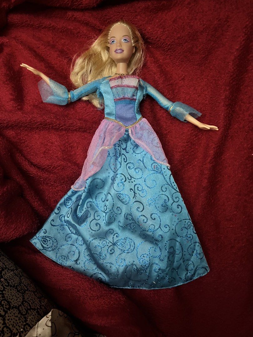Barbie movie doll ( rosella) (Category: Figurines & Statues) located in Manila. Submitted by happydays.com (Listing ID 1462613652, Image 2). Description: - Barbie Movie Doll -Island princess Rosella Flaws Not singing 2 pcs bald spot Has damages on gown -See photos for reference.