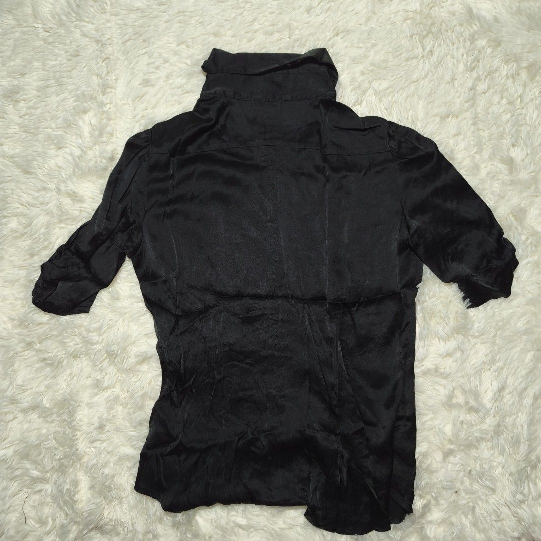 Bebe Black Satin Button-Up Blouse Size M (Category: Blouses) located in Antipolo. Submitted by alphaomega_fox (Listing ID 1462570821, Image 2). Description: - Brand: Bebe - Color: Black - Material: Satin - Style: Button-up blouse - Neckline: Collared - Sleeves: Three-quarter with ruched detail - Size: Medium (M) - Origin: Made in China - Versatility: Perfect for dressing up or down 19x24 200 plus sf.