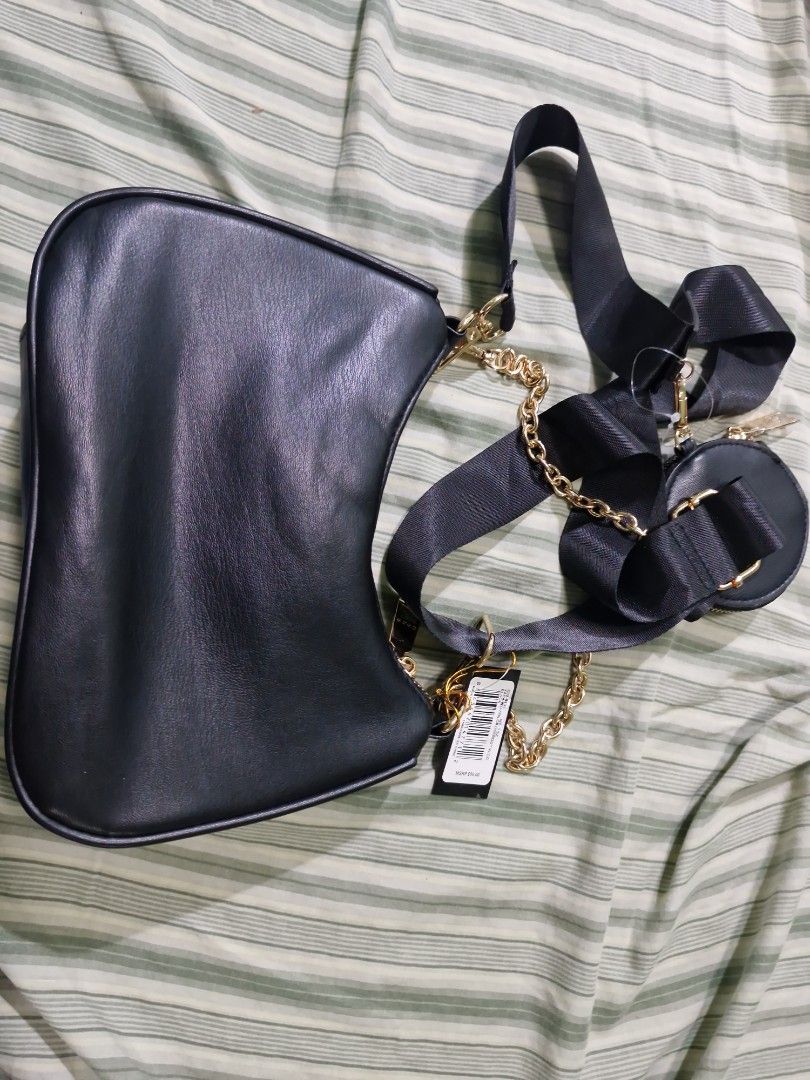 Bebe Woven Shoulder Bag with Coin Pouch (Category: Purses & Pouches) located in Manila. Submitted by inaydearest (Listing ID 1462443786, Image 2). Description: - Brand: Bebe - Color: Black - Material: Woven - Style: Shoulder Bag - Hardware: Gold details - Straps: Detachable chain and fabric strap - Includes: Matching circular coin pouch - Interior: Zip pocket - Versatile: Great for everyday use or nights out - Negotiable Price .