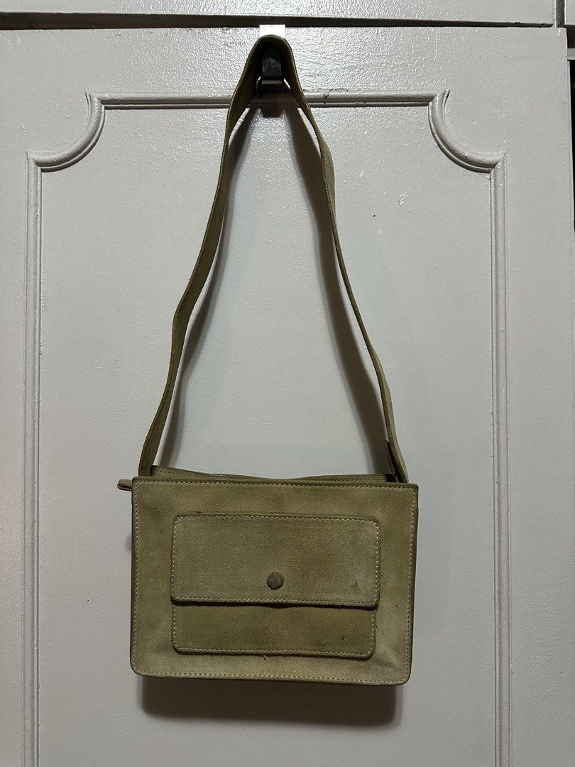 Beige Suede Shoulder Bag with Front Pocket (Category: Shoulder Bags) located in Paranaque City. Submitted by gianina129 (Listing ID 1462576134, Image 1). Description: - Light beige suede shoulder bag - Front flap pocket with button closure - Adjustable strap with side buttons - Simple and classic design - Ideal for everyday use.