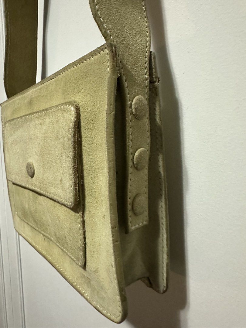 Beige Suede Shoulder Bag with Front Pocket (Category: Shoulder Bags) located in Paranaque City. Submitted by gianina129 (Listing ID 1462576134, Image 3). Description: - Light beige suede shoulder bag - Front flap pocket with button closure - Adjustable strap with side buttons - Simple and classic design - Ideal for everyday use.
