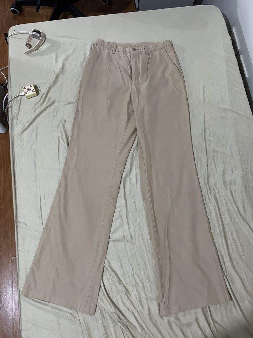 Beige Wide Leg Trousers (Category: Other Bottoms) located in Manaoag. Submitted by thedaintyarts (Listing ID 1462614726, Image 2). Description: - Beige wide leg trousers - Button and zip closure - Two front pockets - Flared leg design - Versatile for casual or dressy occasions - Easy to style Size 26-28 Loc Mandaluyong .