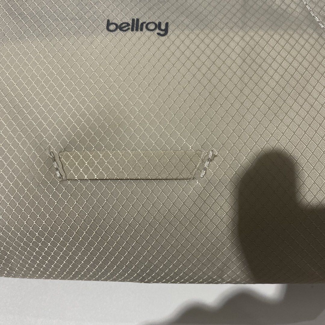 Bellroy Sling Bag - Light Beige (Category: Sling Bags) located in Manila. Submitted by eddjohn (Listing ID 1462562129, Image 2). Description: - Bellroy sling bag in a stylish light beige color. - Features a textured material for a premium feel. - Adjustable strap with a secure buckle closure for a customized fit. - Includes a small loop detail on the front for added functionality. - Perfect for everyday use, offering a compact and practical stora