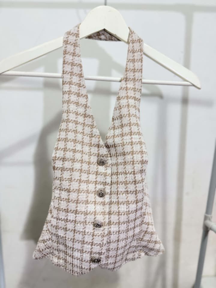 Bkk top Tweed Halter Top with Button Detail (Category: Sleeveless) located in Dasmarinas. Submitted by neya0512 (Listing ID 1462587280, Image 1). Description: - Chic tweed halter top - Classic brown and white plaid pattern - Button details down the front - Flattering deep V-neckline - Slightly flared hem for a stylish silhouette - Perfect for dressing up or down.