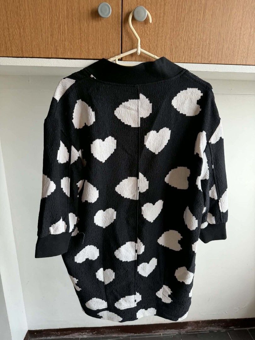 Black & White Heart Pattern Long Cardigan (Category: Coats, Jackets and Outerwear) located in Manila. Submitted by atozstuff (Listing ID 1462447486, Image 2). Description: - Cute black cardigan - All-over white heart pattern - Button-up front - Functional front pockets - Ideal for layering - Comfy and stylish - Perfect for casual wear.