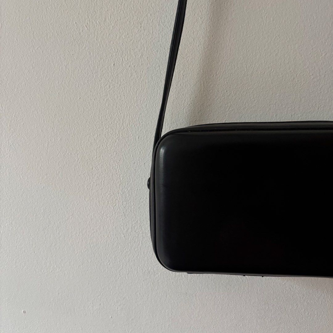 Black Crossbody Bag (Category: Clutches) located in Quezon City. Submitted by dcoffeeholic (Listing ID 1462548086, Image 2). Description: Black crossbody clutch bag.