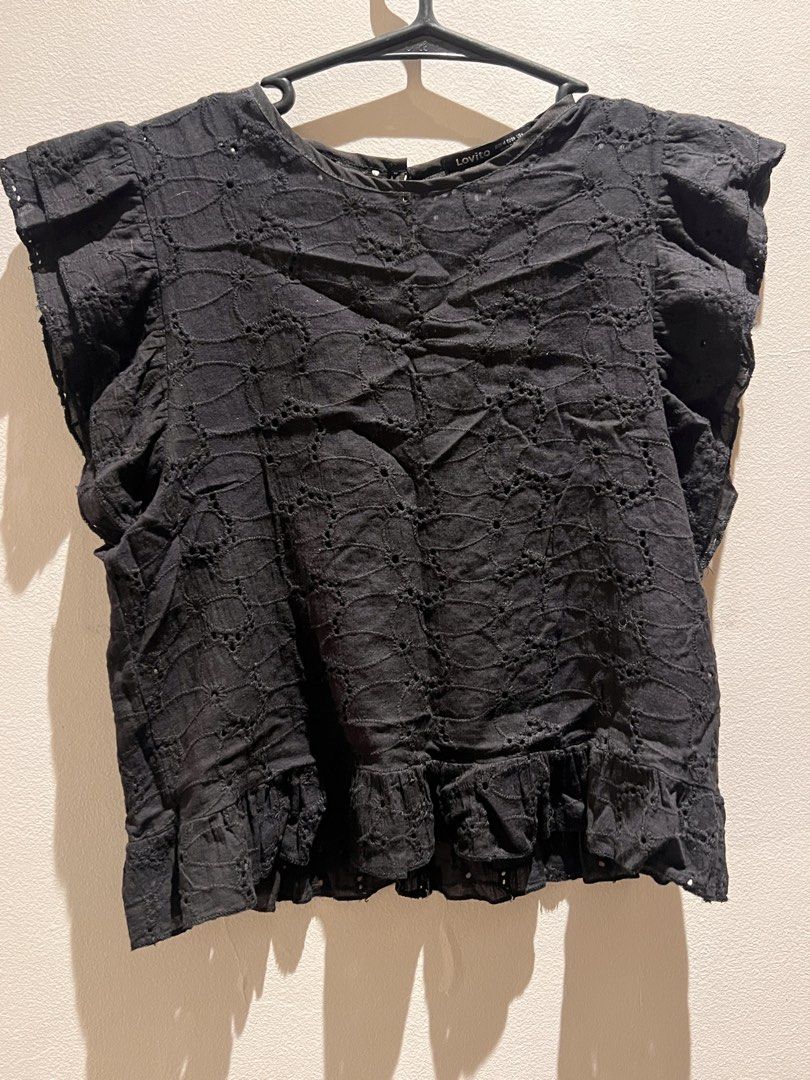 Black Eyelet Ruffle Sleeve Top (Category: Blouses) located in Quezon City. Submitted by cmrls (Listing ID 1462618734, Image 2). Description: - Cute black top - Eyelet details - Short ruffle sleeves - Peplum hem - Button closure at the back - Versatile: pairs well with jeans or skirts - Comfortable and stylish for any occasion.