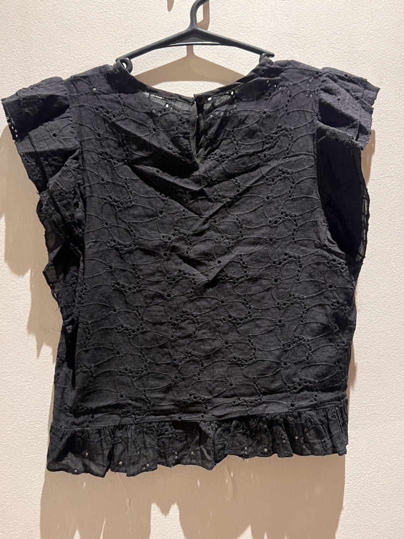 Black Eyelet Ruffle Sleeve Top (Category: Blouses) located in Quezon City. Submitted by cmrls (Listing ID 1462618734, Image 3). Description: - Cute black top - Eyelet details - Short ruffle sleeves - Peplum hem - Button closure at the back - Versatile: pairs well with jeans or skirts - Comfortable and stylish for any occasion.
