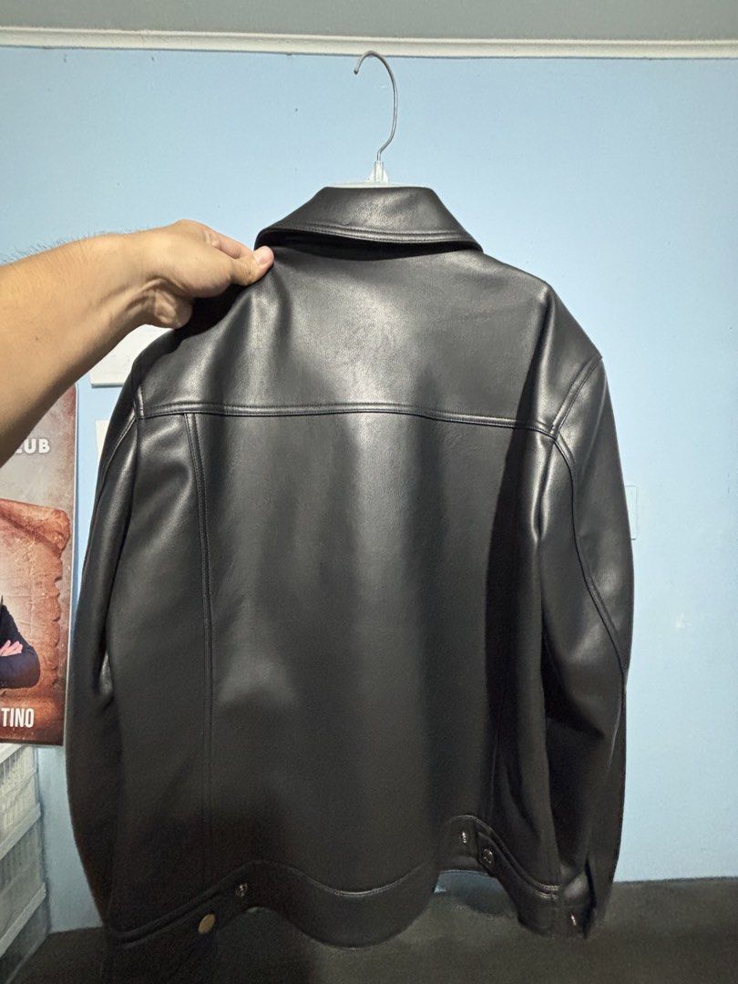 Black Faux Leather Jacket (Category: Coats, Jackets and Outerwear) located in Cainta. Submitted by iam.constantin (Listing ID 1462570771, Image 3). Description: - Classic black faux leather jacket - Button-up front - Two chest pockets - Collared neckline - Versatile for casual or dressed-up outfits.