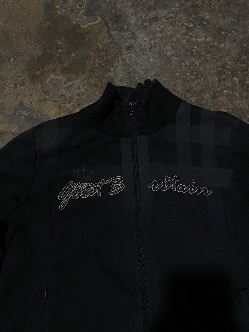 Black Great Britain Track Jacket (Category: Coats, Jackets and Outerwear) located in Munoz. Submitted by bb_jimbo0 (Listing ID 1462626753, Image 2). Description: - Black track jacket - 'Great Britain' embroidered on front - Checkered pattern on upper back and shoulders - Full zip closure - Ribbed cuffs and hem - Made from a cotton blend.