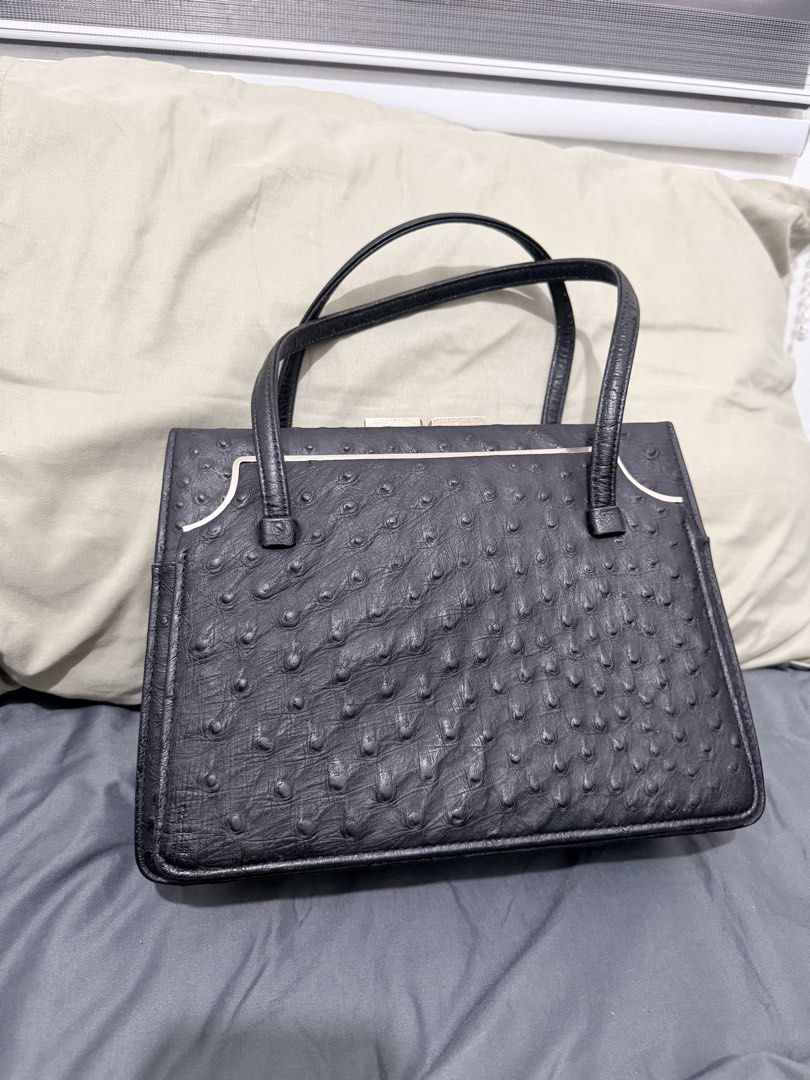 Genuine Black Ostrich Embossed Handbag NO ISSUE (Category: Luxury Bags & Wallets) located in Quezon City. Submitted by itssav (Listing ID 1462461809, Image 1). Description: - Classic black handbag - Textured ostrich-like finish - Secure gold-tone clasp closure - Interior zippered pocket - Smooth leather handles - Timeless and versatile for daily use or special occasions NO ISSUE RFS: decluterring, didnt use anymore Loc QC .