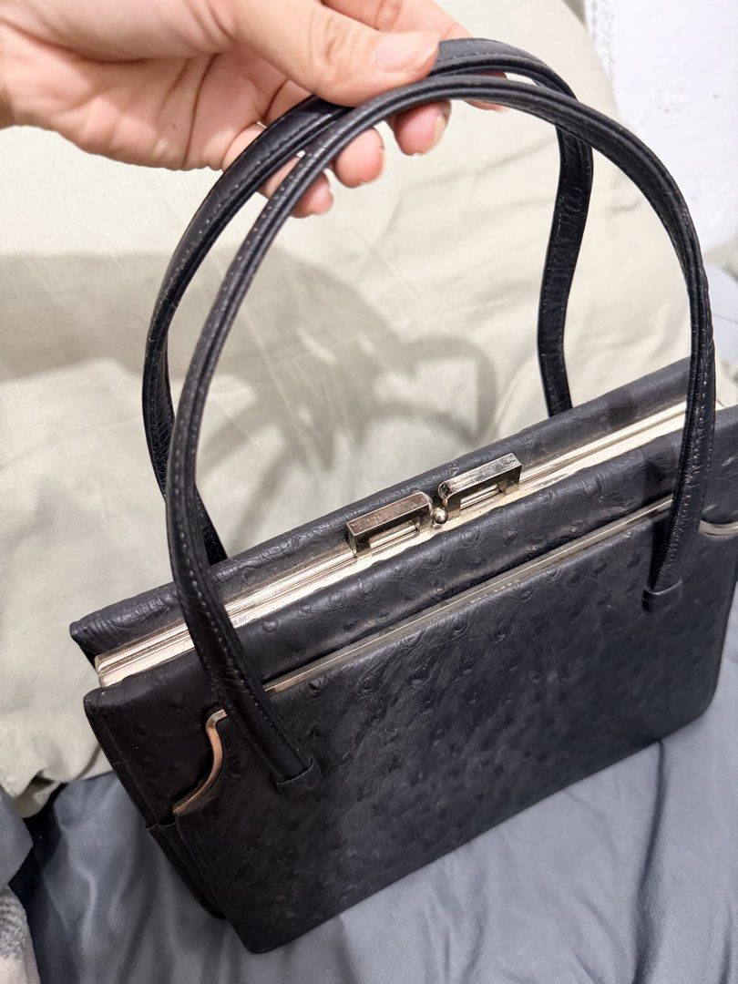 Genuine Black Ostrich Embossed Handbag NO ISSUE (Category: Luxury Bags & Wallets) located in Quezon City. Submitted by itssav (Listing ID 1462461809, Image 3). Description: - Classic black handbag - Textured ostrich-like finish - Secure gold-tone clasp closure - Interior zippered pocket - Smooth leather handles - Timeless and versatile for daily use or special occasions NO ISSUE RFS: decluterring, didnt use anymore Loc QC .