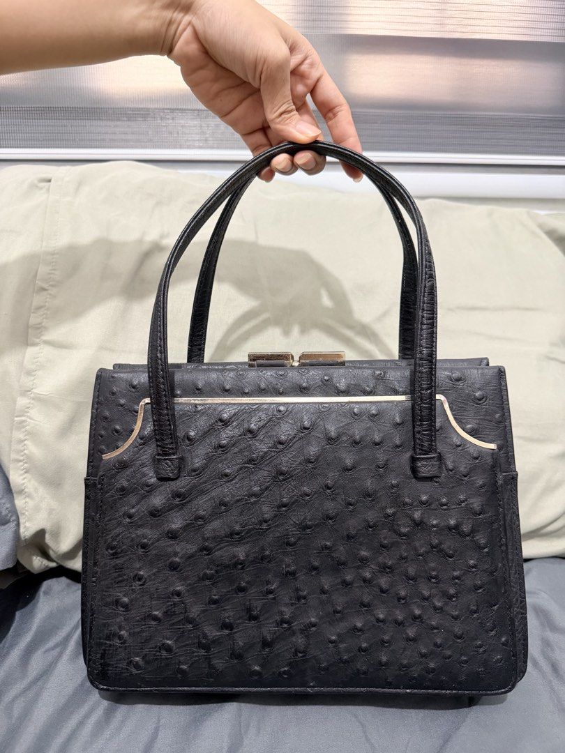 Genuine Black Ostrich Embossed Handbag NO ISSUE (Category: Luxury Bags & Wallets) located in Quezon City. Submitted by itssav (Listing ID 1462461809, Image 2). Description: - Classic black handbag - Textured ostrich-like finish - Secure gold-tone clasp closure - Interior zippered pocket - Smooth leather handles - Timeless and versatile for daily use or special occasions NO ISSUE RFS: decluterring, didnt use anymore Loc QC .