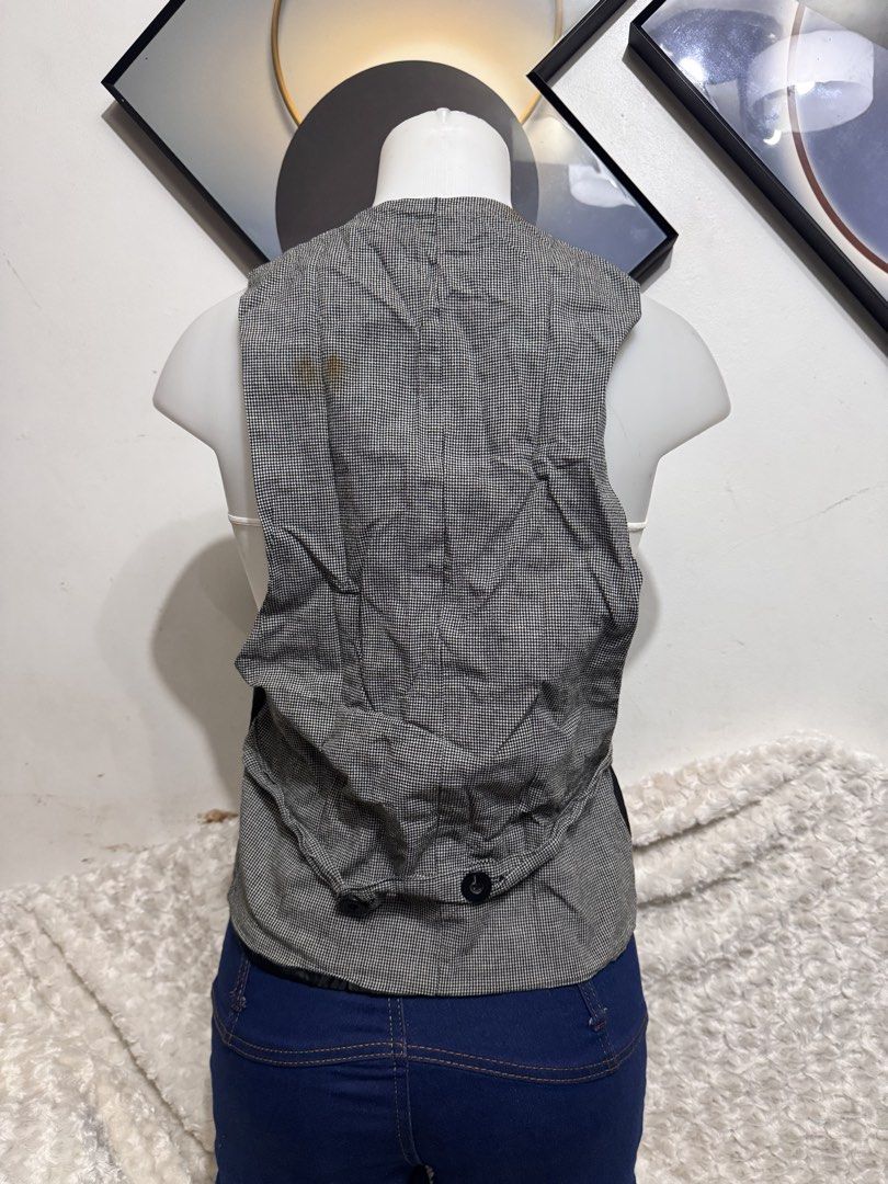 Black Pinstripe Vest with Grey Houndstooth Back (Category: Sleeveless) located in Marikina City. Submitted by lorradel (Listing ID 1462453333, Image 3). Description: - Black pinstripe vest - Button-up front - Two front pockets - Grey houndstooth fabric on the back - Ideal for stylish layering - Elevates any outfit - MAY HAVE some washable stains (hindi maiiwasan) needs washing; had been stored - mannequin size 34-26-34 - mannequin’s shoulder to a