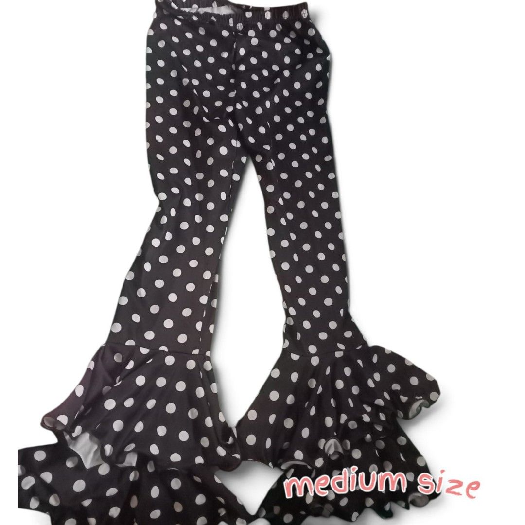Black Polka Dot Bell Bottom Pants - Medium Size (Category: Other Bottoms) located in Manila. Submitted by crustynico23 (Listing ID 1462458537, Image 1). Description: - Adorable black pants with a fun white polka dot pattern. - Features a stylish flared leg with charming ruffle details at the hem. - Comfortable stretchy waistband for a perfect fit. - Size: Medium - Versatile for parties or casual everyday outfits. - Playful and eye-catching design