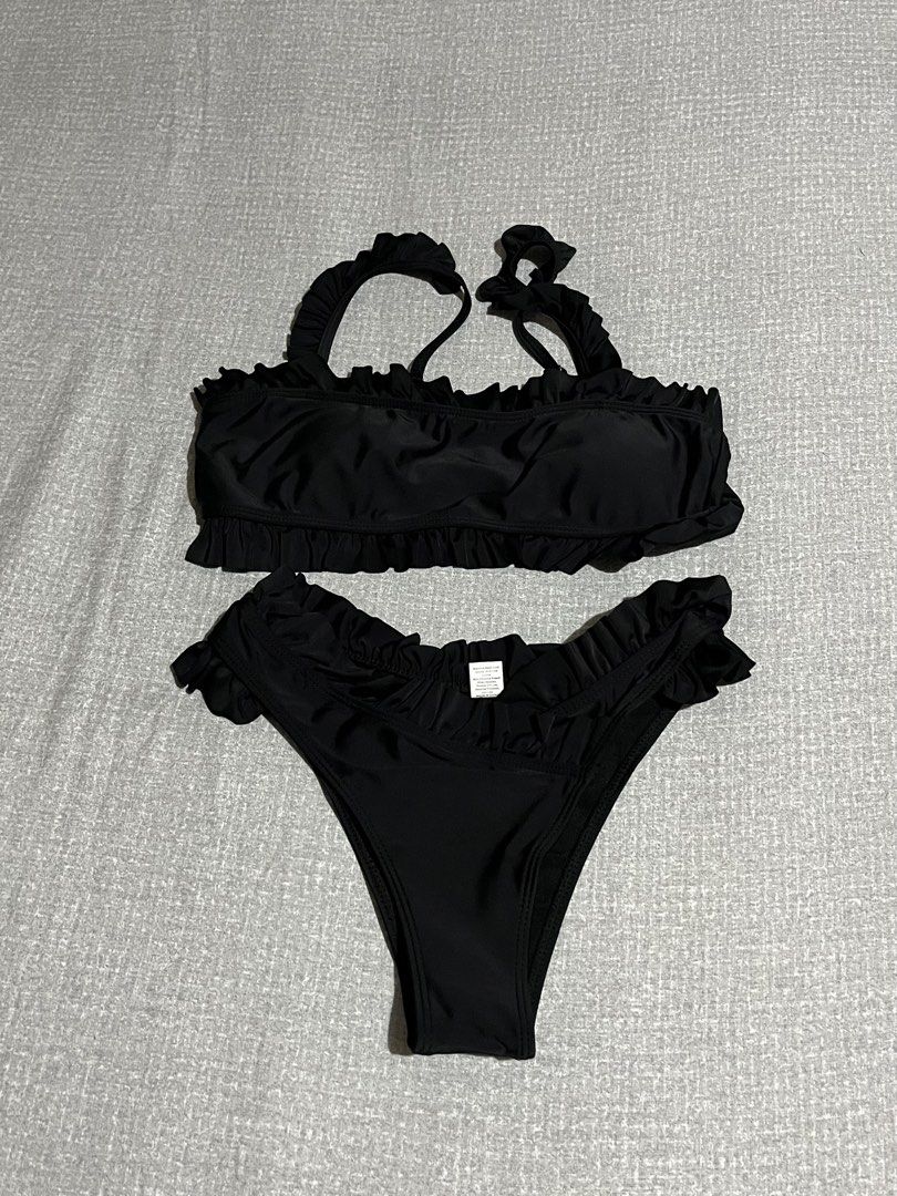 Black Ruffle Bikini Set (Category: Bikinis & Swimsuits) located in Manila. Submitted by az0r_ (Listing ID 1462503373, Image 1). Description: - Adorable black bikini with charming ruffle details. - Adjustable tie-back straps for a perfect fit. - Flirty ruffles on the sides of the bikini bottoms. - Crafted from a comfortable nylon and spandex blend. - Ideal for your next beach vacation or pool day!.