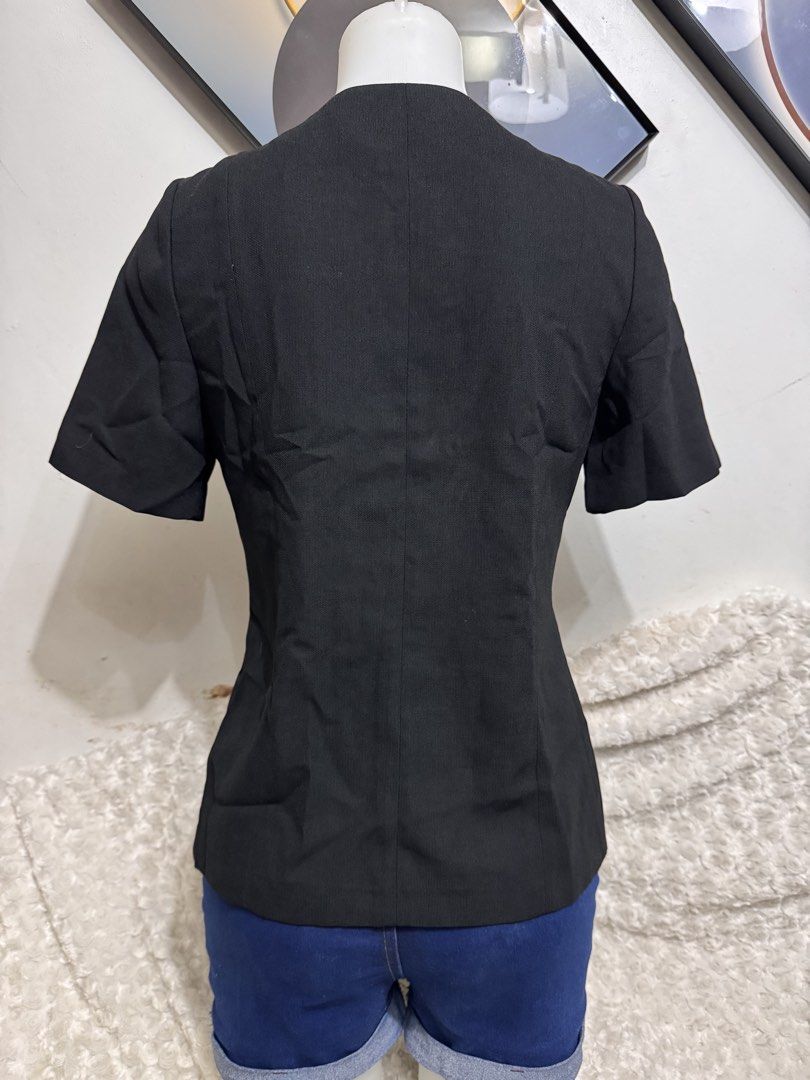Black Short Sleeve Blazer with White Polka Dot Collar (Category: Coats, Jackets and Outerwear) located in Marikina City. Submitted by lorradel (Listing ID 1462460417, Image 3). Description: - shoulder length 14in - Stylish black blazer with short sleeves. - Features a unique white polka dot detail around the collar. - Open front design for easy wear. - Versatile for smart casual or office attire. - Looks great with jeans or trousers..