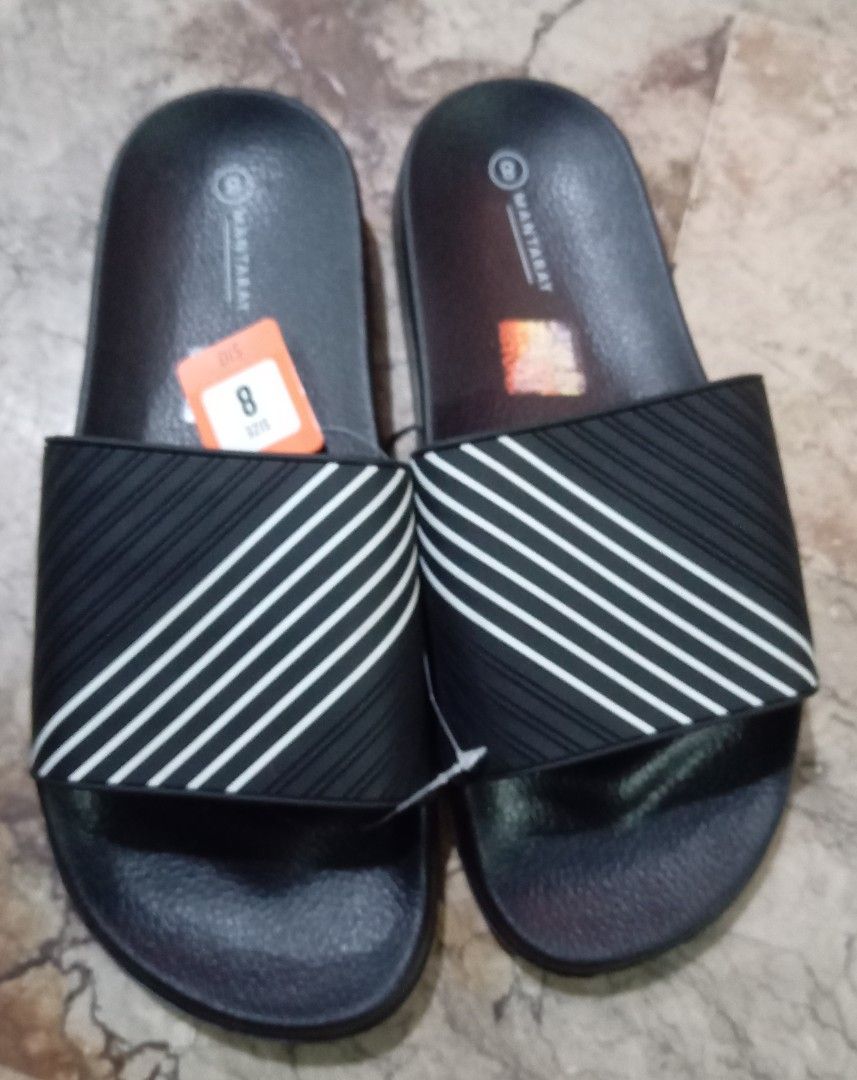 Blue Slides (Category: Slippers & Slides) located in Quezon City. Submitted by chacha30.s (Listing ID 1462567857, Image 1). Description: - Brand: Blue slides - Size: 8 - Material: Synthetic upper, lining, and sole - Origin: Made in China - Features: Comfortable design with a striped strap - Best for: Casual wear, post-sport relaxation - Condition: Brand new, never worn, with tags attached . Text me at 09277152134 . Buy na po kayo/Offer lang po ka