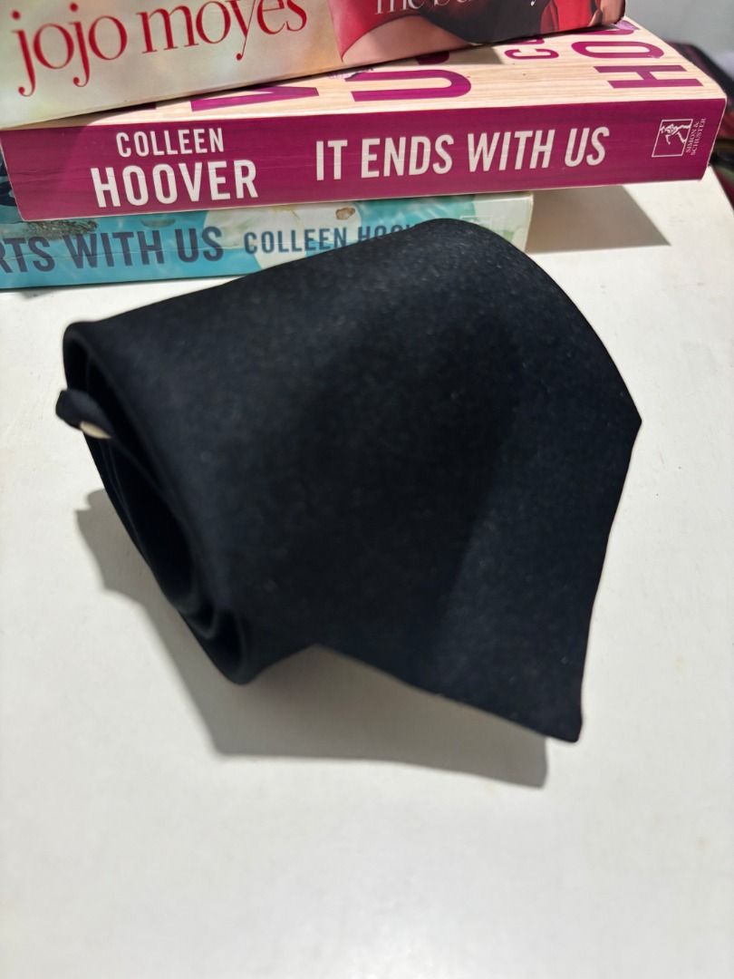 Black Tie (Category: Ties) located in Baao. Submitted by apr1979 (Listing ID 1462447629, Image 1). Description: - Classic black tie - Simple and versatile design - Suitable for formal events or business wear - Fabric features a subtle sheen - Inner label has some writing - Standard length - Great addition to any wardrobe.