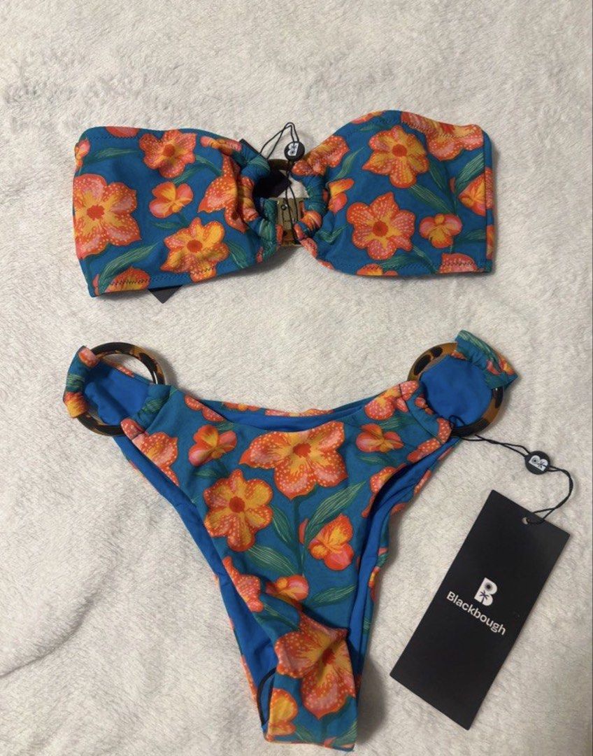 Blackbough Floral Bikini Set XS (Category: Bikinis & Swimsuits) located in Manila. Submitted by felicavestis (Listing ID 1462675522, Image 1). Description: - Vibrant orange and pink floral print bikini - Strapless bandeau top with gold ring detail - Matching high-cut bottoms with tortoise shell ring details - Made with recycled nylon and spandex - Size XS - Hand wash cold -tag removed thought i was gonna use it.