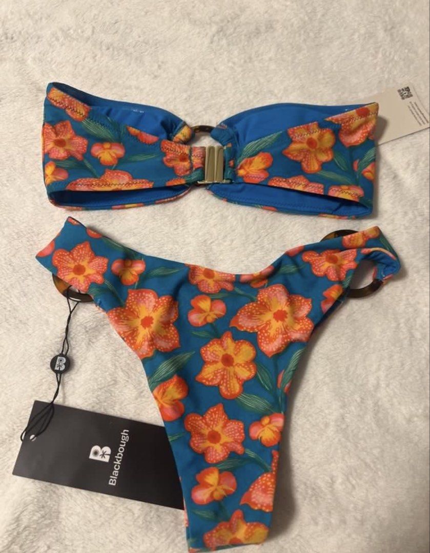 Blackbough Floral Bikini Set XS (Category: Bikinis & Swimsuits) located in Manila. Submitted by felicavestis (Listing ID 1462675522, Image 2). Description: - Vibrant orange and pink floral print bikini - Strapless bandeau top with gold ring detail - Matching high-cut bottoms with tortoise shell ring details - Made with recycled nylon and spandex - Size XS - Hand wash cold -tag removed thought i was gonna use it.