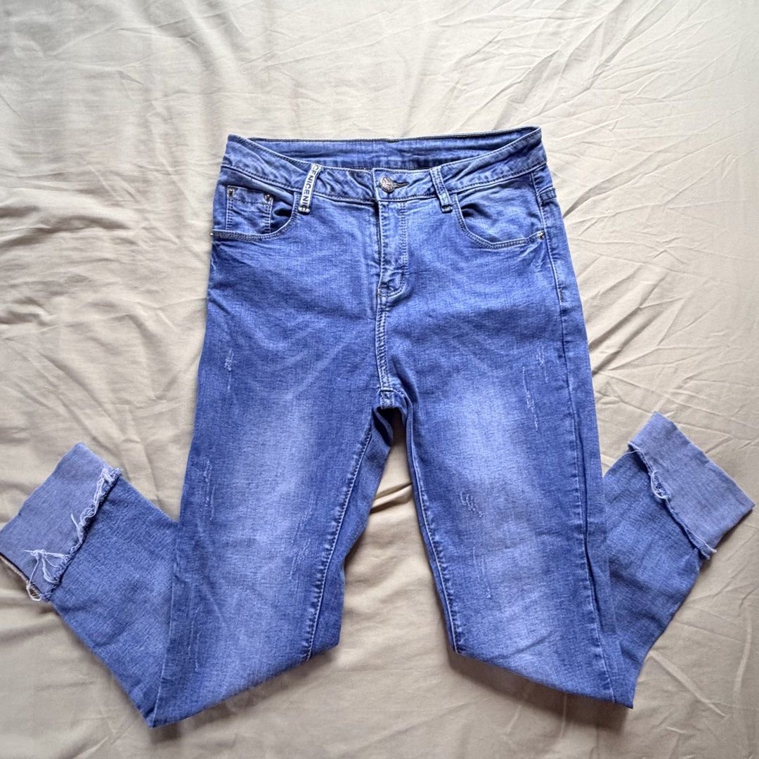 Blue Denim Jeans (Category: Jeans) located in Tabaco. Submitted by shae_3 (Listing ID 1462516081, Image 1). Description: - Size: 27 inches - Length: 32 inches - Distressed look on knees and hem - Cuffed bottoms with frayed edges - Button and zip closure - Classic five-pocket styling - Comfortable fit for everyday wear - Perfect for your casual wardrobe.