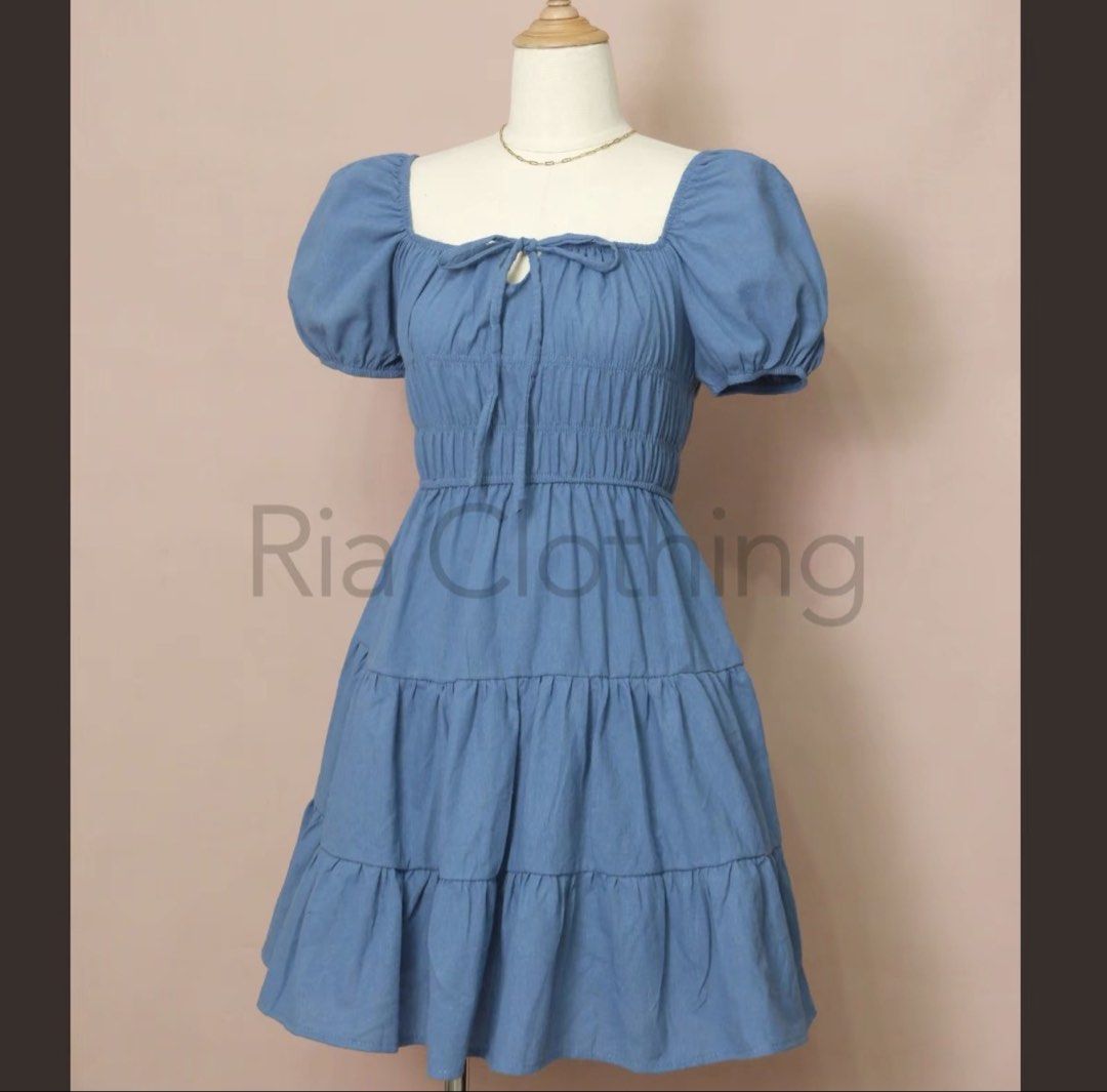 Blue Puff Sleeve Tiered Square Neck Dress (Category: Dresses) located in Caloocan City. Submitted by laleleigh (Listing ID 1462517841, Image 1). Description: - Dusty blue dress - Features puff sleeves and a square neckline - Smocked bodice for a comfortable fit - Tiered skirt for a playful look - Ties at the front for adjustable styling - Ideal for casual outings and everyday wear - MOP: Gcash/Bank transfer.