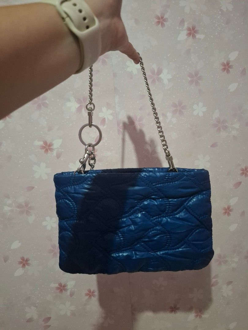 Blue Quilted Handbag Charm not included (Category: Luxury Bags & Wallets) located in Cavite. Submitted by sweetalittlemonstertoo (Listing ID 1462594803, Image 2). Description: charm not included - Adorable blue quilted handbag - Features a shiny, eye-catching quilted pattern - Includes a chic silver chain strap - Comes with a fun cherry charm accessory - Perfect for carrying your daily essentials - Compact and lightweight for easy portability.
