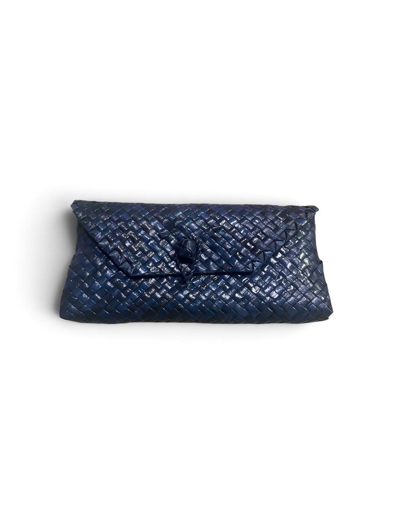 Blue Woven Leather Clutch Bag (Category: Clutches) located in Valenzuela. Submitted by _tann17 (Listing ID 1462644698, Image 1). Description: - Navy blue woven leather clutch - Features a knot detail on the flap closure - Ideal for evening events or adding a pop of color to any outfit - Spacious enough to hold your essentials - Interior is clean and well-maintained.