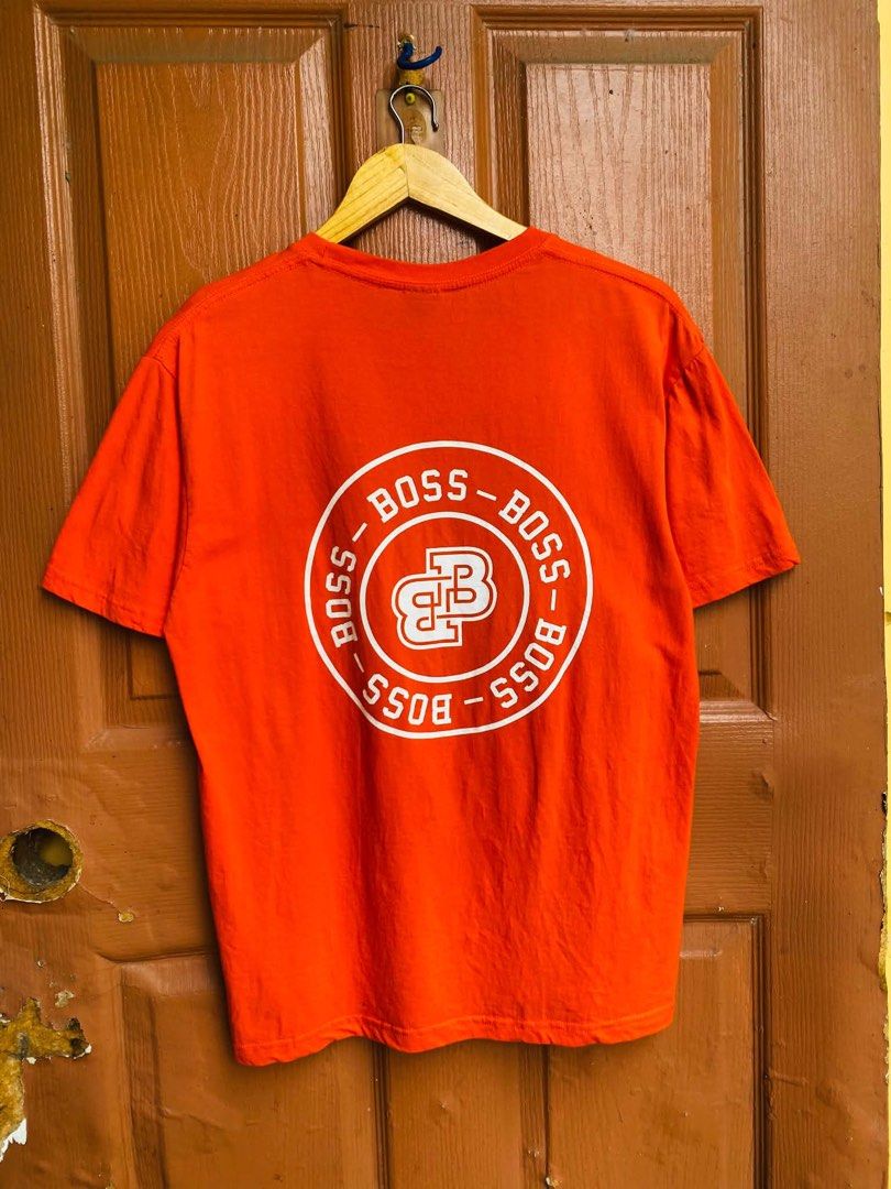 BOSS Orange T-Shirt Size M (Category: Tshirts & Polo Shirts ) located in Digos. Submitted by thrifthed.ph (Listing ID 1462666223, Image 1). Description: - Orange BOSS t-shirt -med -like new -cl:10/10 -authentic -dimes:20/28 -no issue -solid condi -solid colorate -authentic -suitable for picky buyer - - Features circular BOSS logo graphic on the back - Smaller BOSS logo on the chest - Made from comfortable material - Ideal for casual wear - Please